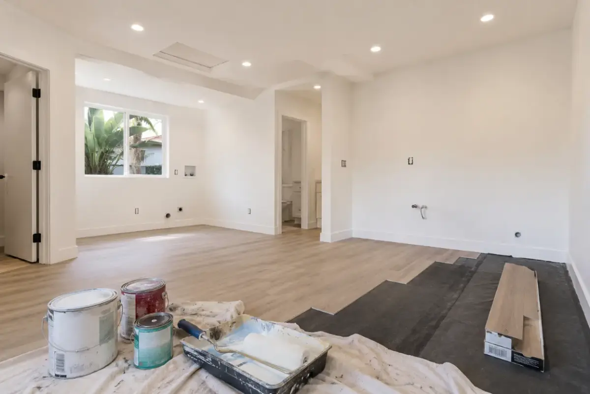 Garage being converted into an ADU living space with light low-VOC interior walls