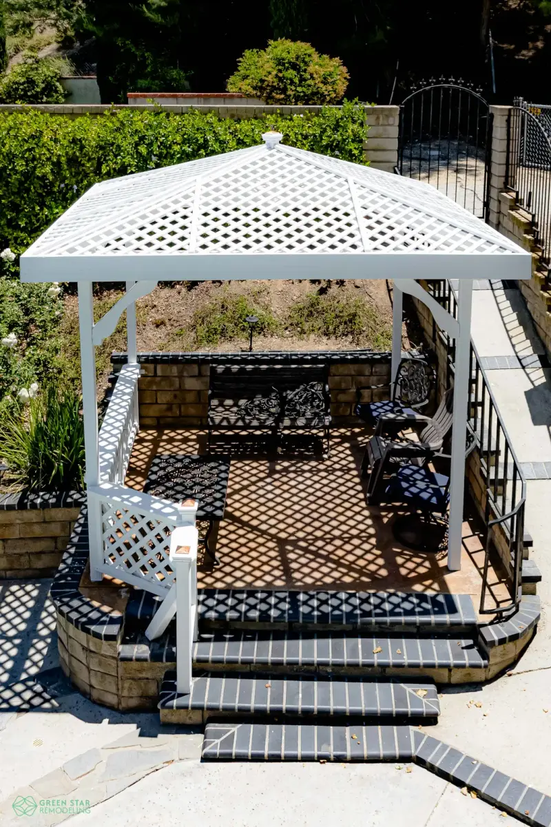 White lattice gazebo over a remodeled backyard patio in Santa Clarita.