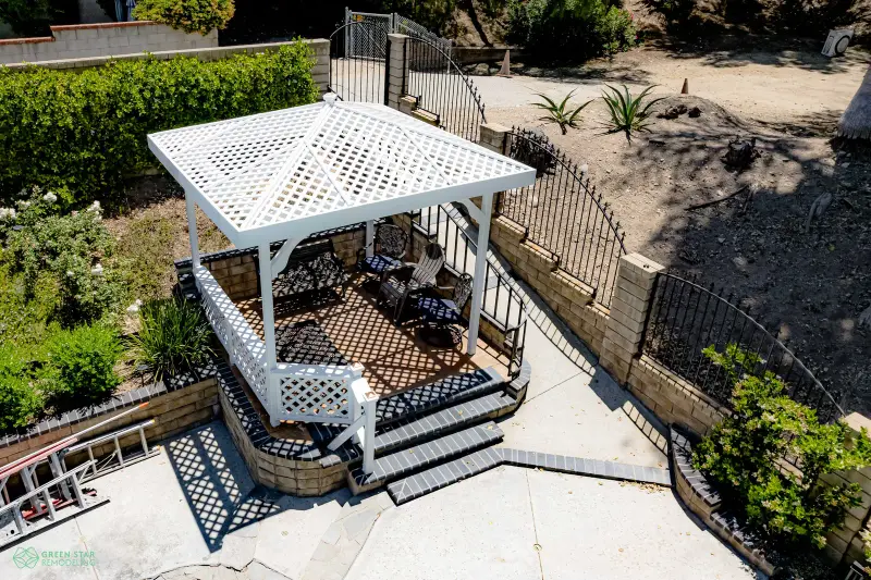 White lattice gazebo and patio remodel in a Santa Clarita backyard.