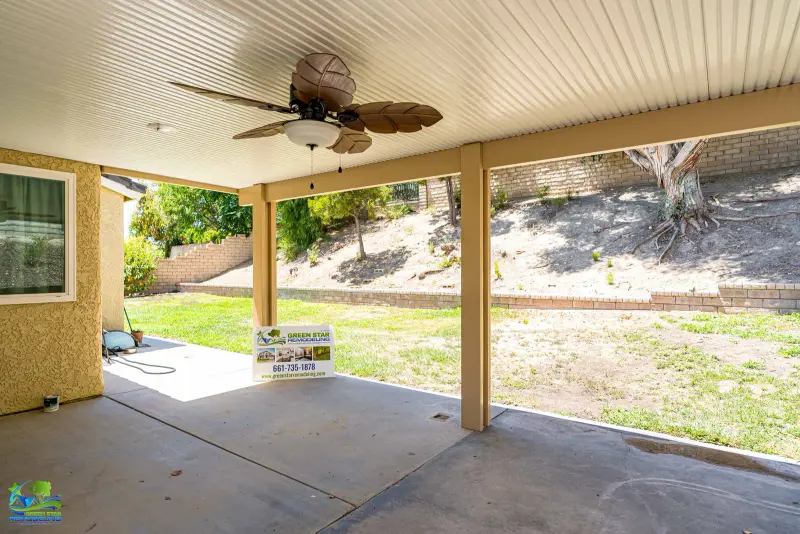 Outdoor patio cover with a ceiling fan installed in Santa Clarita by Green Star Remodeling.