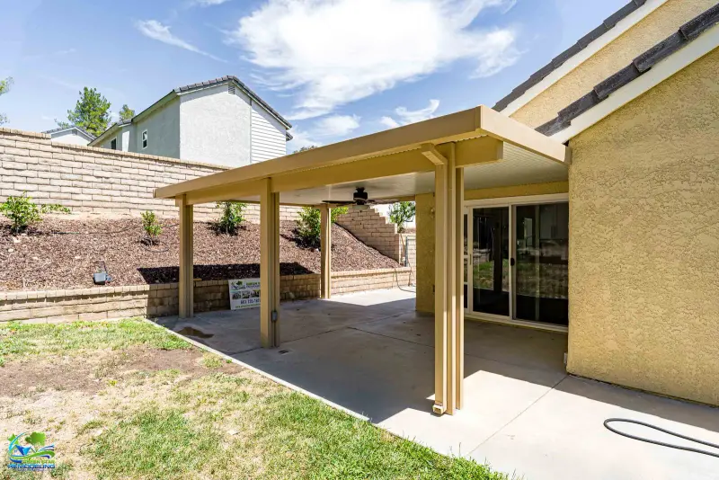 Tan aluminum patio cover installation in Santa Clarita.