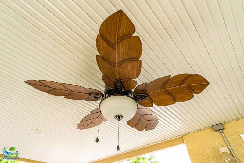 Tropical leaf-blade ceiling fan mounted under an outdoor patio cover in Santa Clarita.