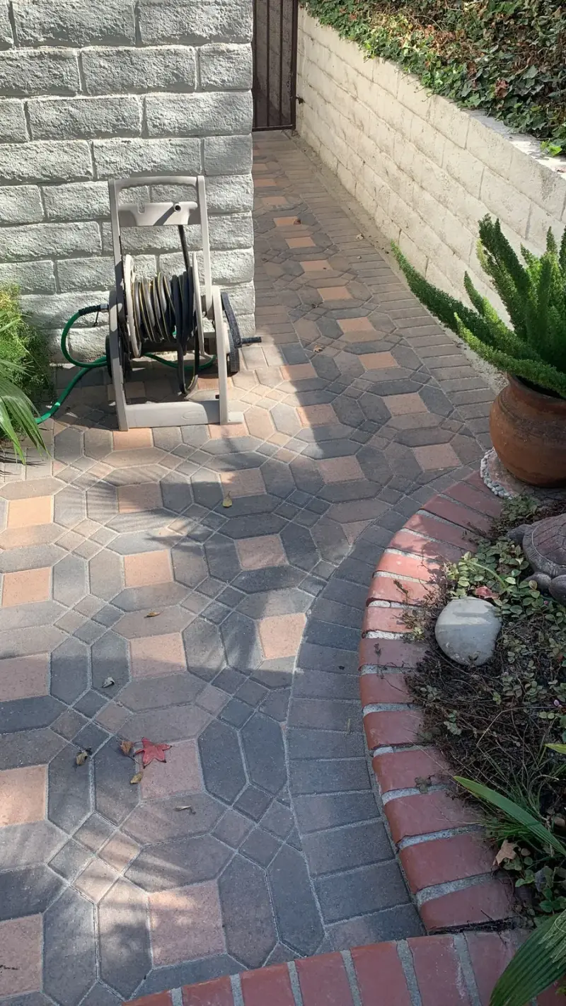 Decorative paver patio and garden walkway in a Calabasas backyard.